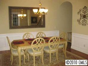 747 Quicksilver Trail Fort Mill, SC 29708 - Photo 2 of 8 a view of a dining room with furniture and wooden floor