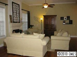 747 Quicksilver Trail Fort Mill, SC 29708 - Photo 3 of 8 a living room with a couch and a ceiling fan
