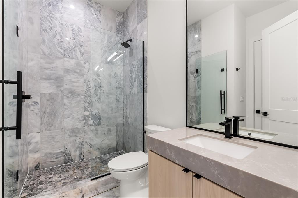 3316 Helen Avenue Orlando, FL 32804 - Photo 50 of 57 a bathroom with a sink a toilet and shower