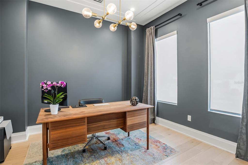 3316 Helen Avenue Orlando, FL 32804 - Photo 52 of 57 a room with a table chairs and chandelier