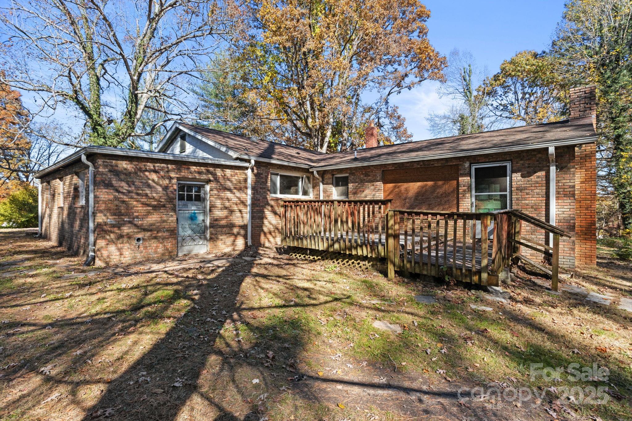 601 East Blue Ridge Road East Flat Rock, NC 28726 - Photo 16 of 48 a view of a yard with wooden fence
