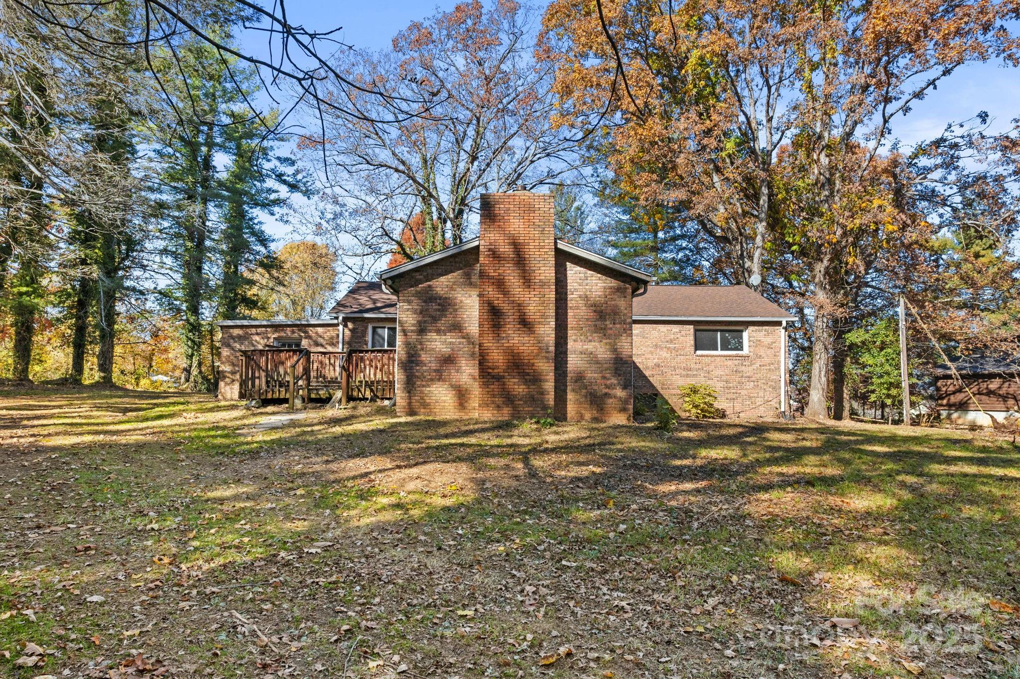 601 East Blue Ridge Road East Flat Rock, NC 28726 - Photo 18 of 48 a front view of a house with a yard