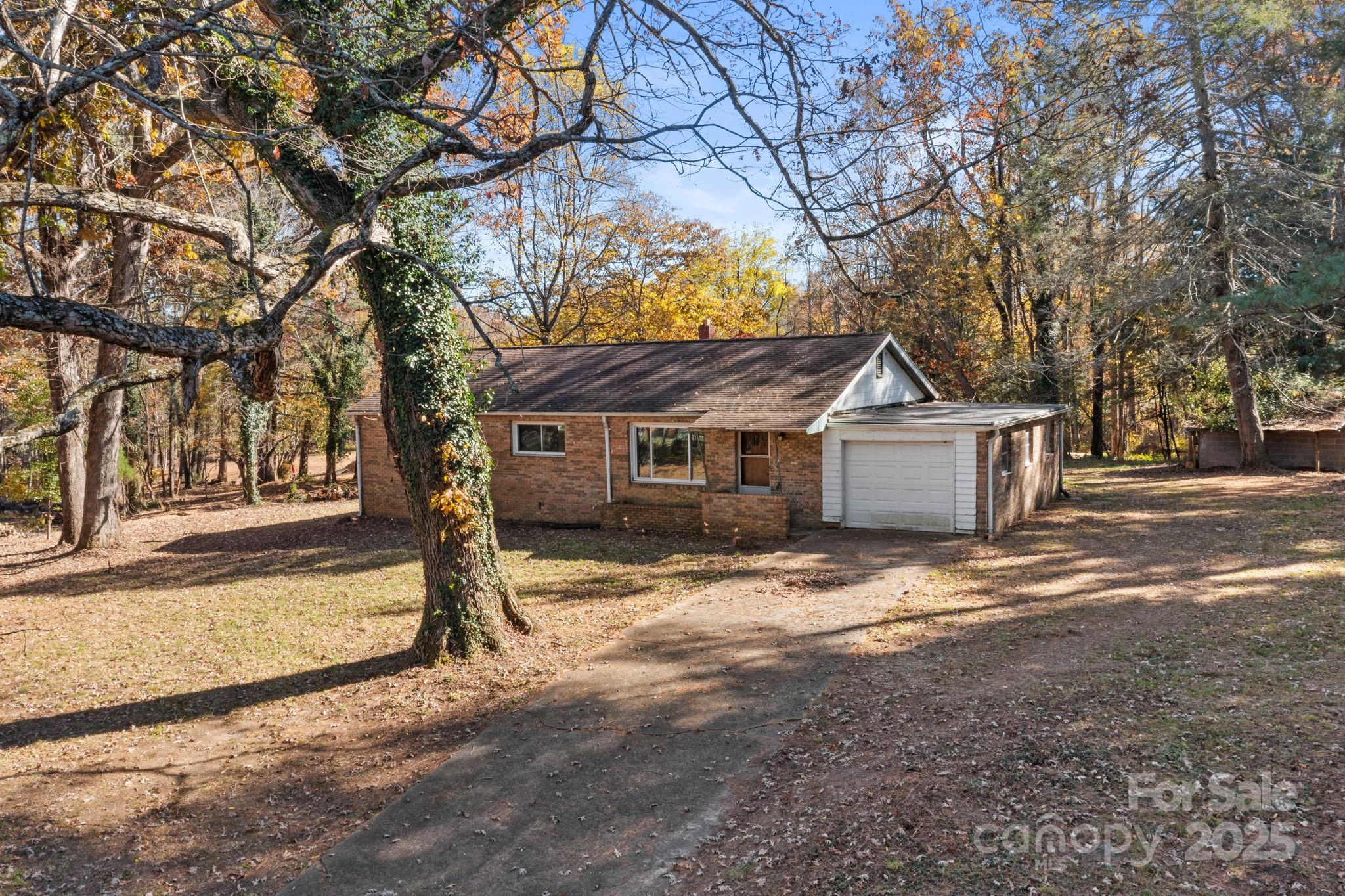 601 East Blue Ridge Road East Flat Rock, NC 28726 - Photo 20 of 48 a front view of a house with a yard