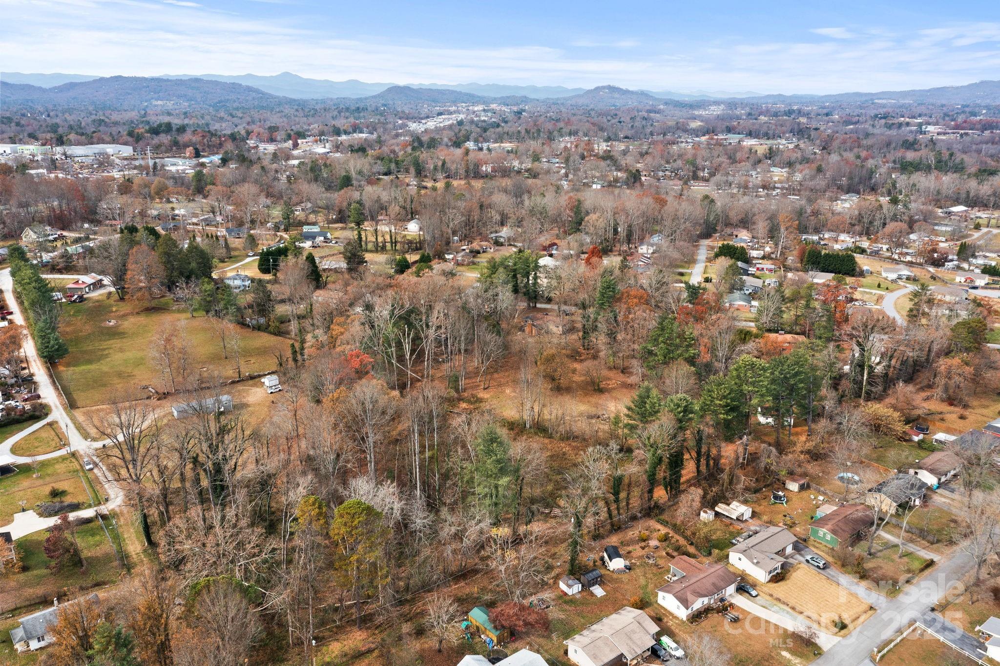601 East Blue Ridge Road East Flat Rock, NC 28726 - Photo 31 of 48 an aerial view of residential house with green space