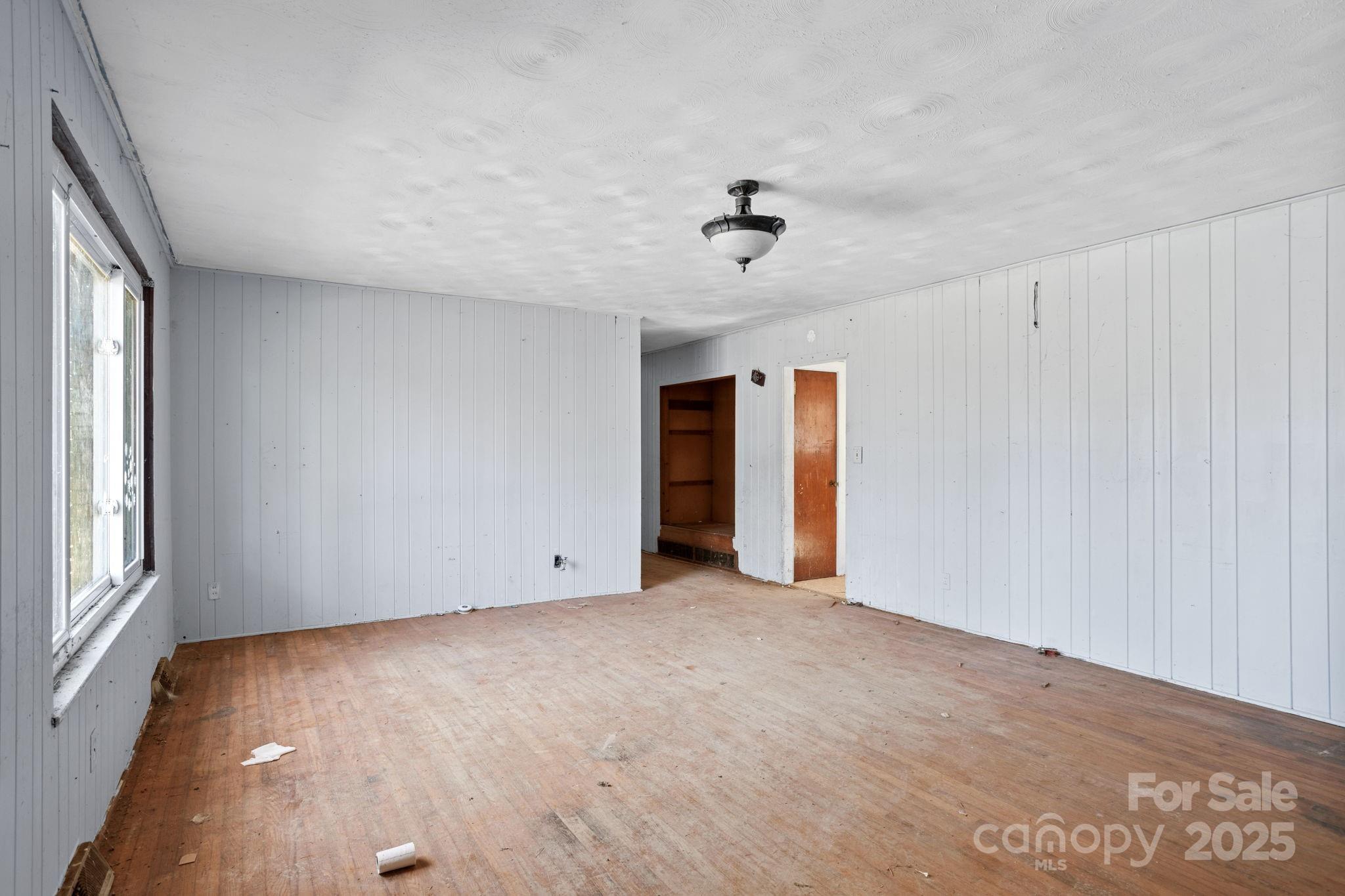 601 East Blue Ridge Road East Flat Rock, NC 28726 - Photo 4 of 48 a view of an empty room with a window