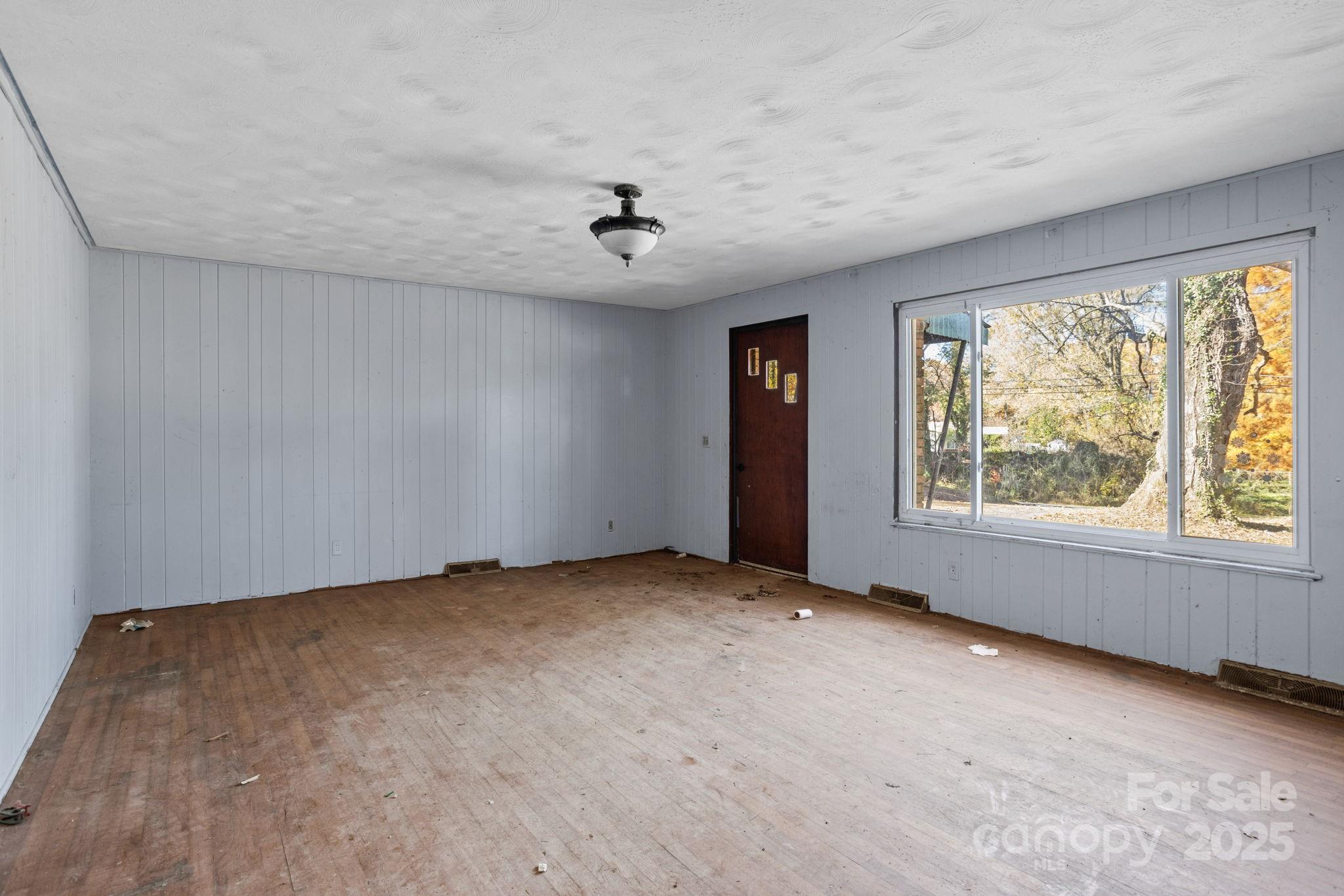 601 East Blue Ridge Road East Flat Rock, NC 28726 - Photo 5 of 48 an empty room with windows