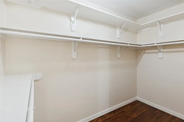 a view of an empty walk in closet