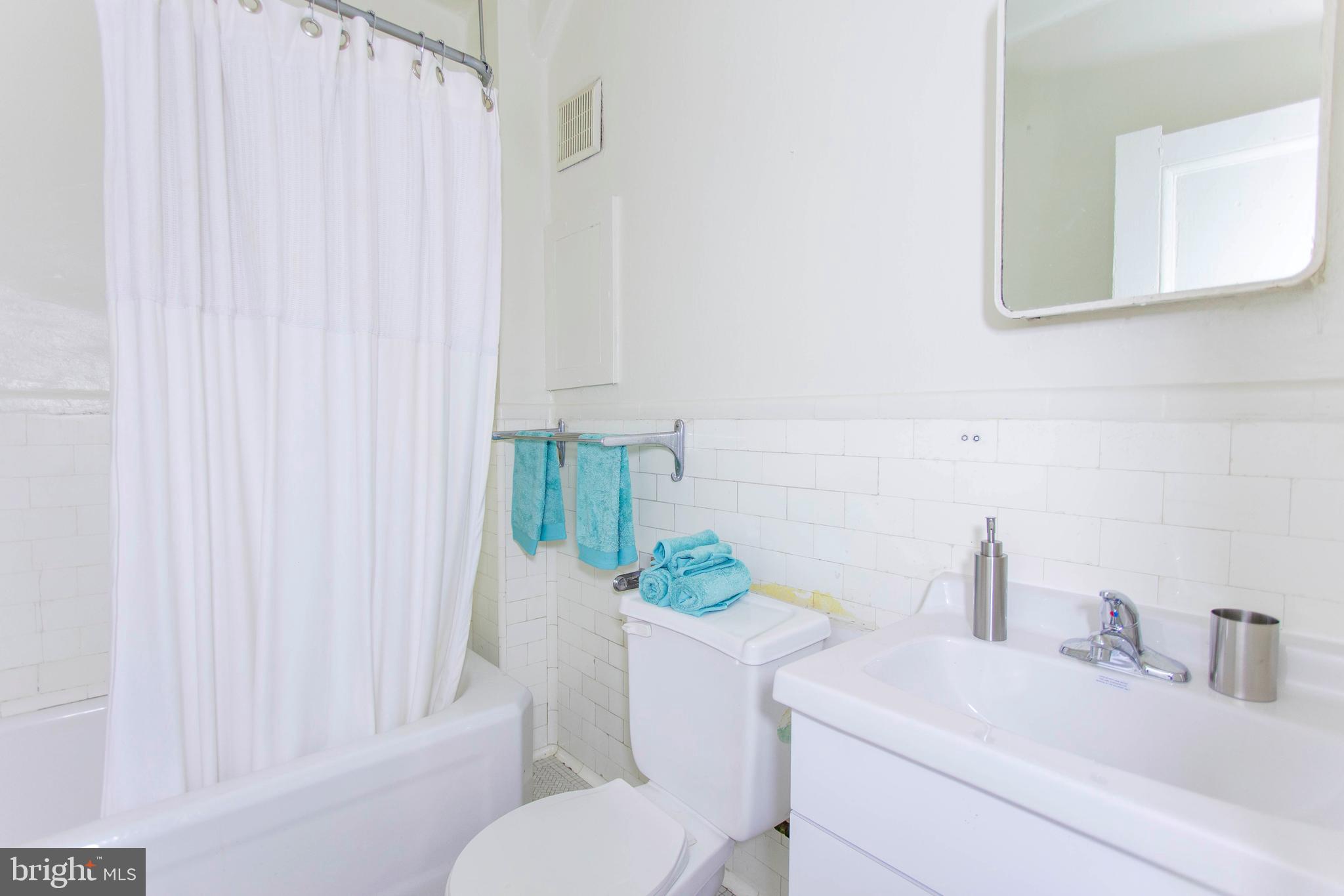 1229 Chestnut Street, Unit 1105 Philadelphia, PA 19107 - Photo 5 of 21 a bathroom with a sink toilet and shower