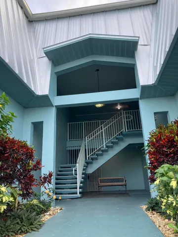a view of entryway with flower pots