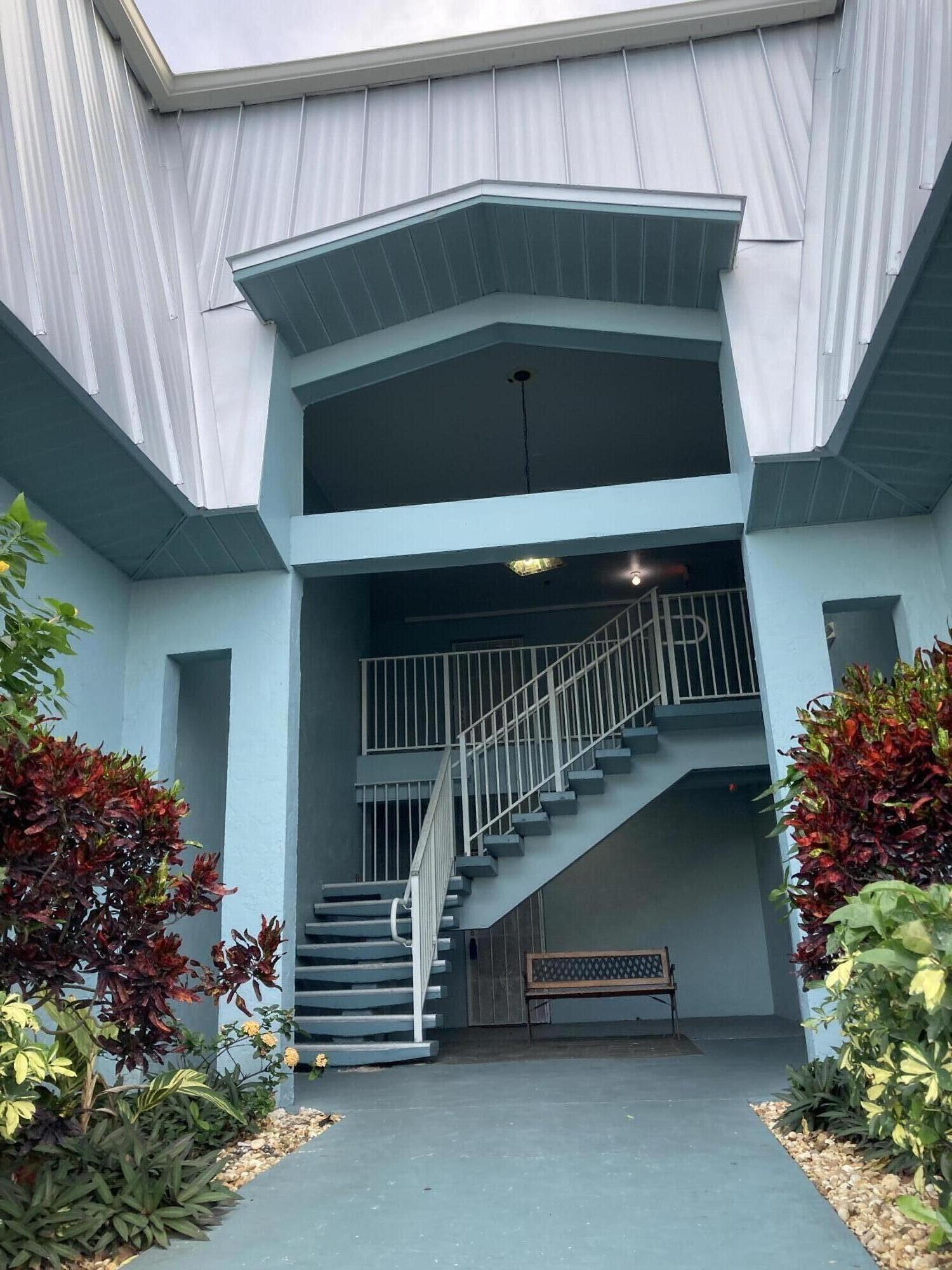 a view of entryway with flower pots