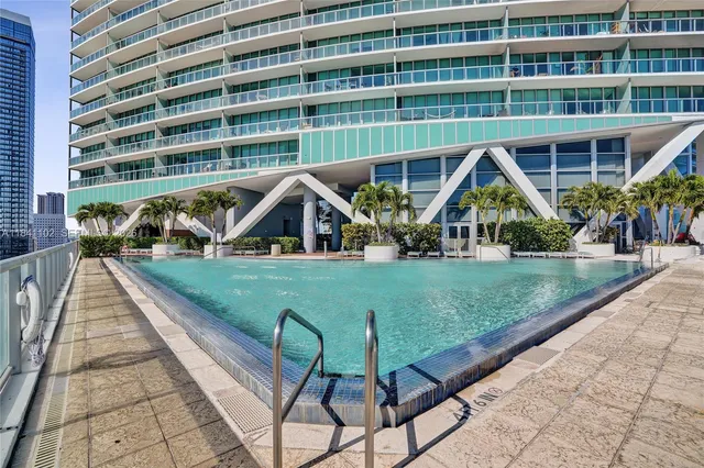 an aerial view of a house with a swimming pool