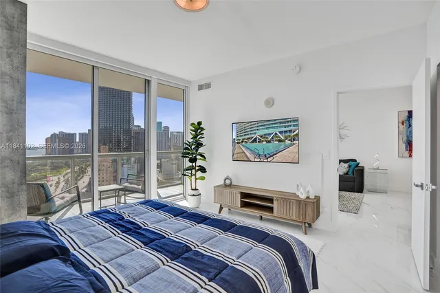 a bedroom with a bed and a couch