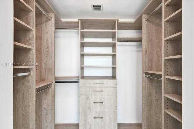 a view of an empty walk in closet