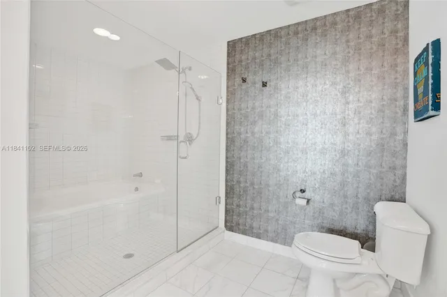 a bathroom with a shower and a toilet