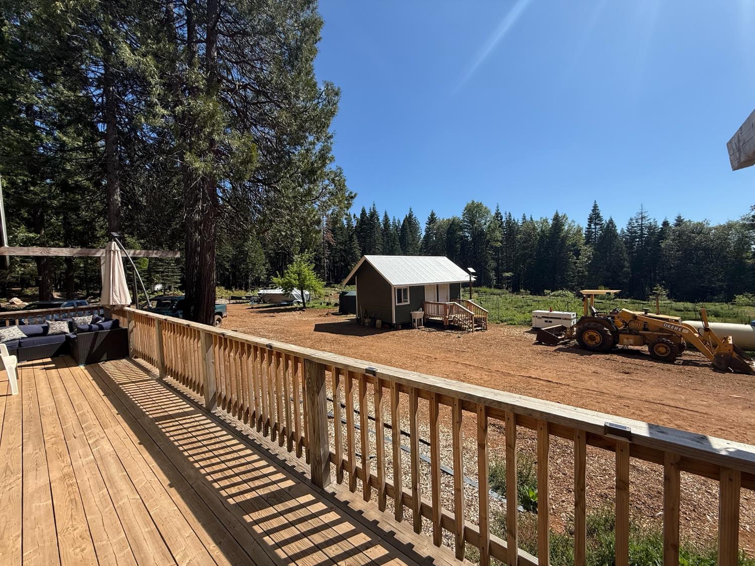 14940 Chalk Bluff Road Nevada City, CA 95959 - Photo 11 of 29 a view of a street with two chairs on the deck