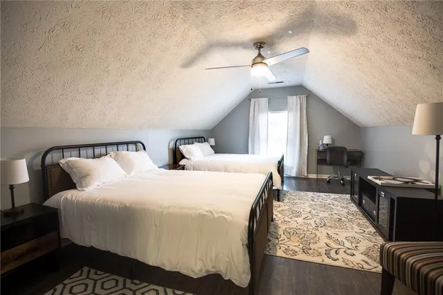 a bedroom with bed and window