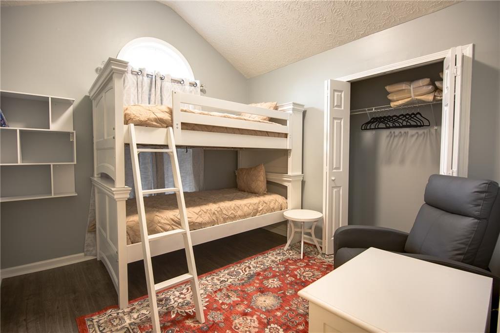 7151 Springchase Way Austell, GA 30168 - Photo 12 of 14 a bedroom with a bed and a window