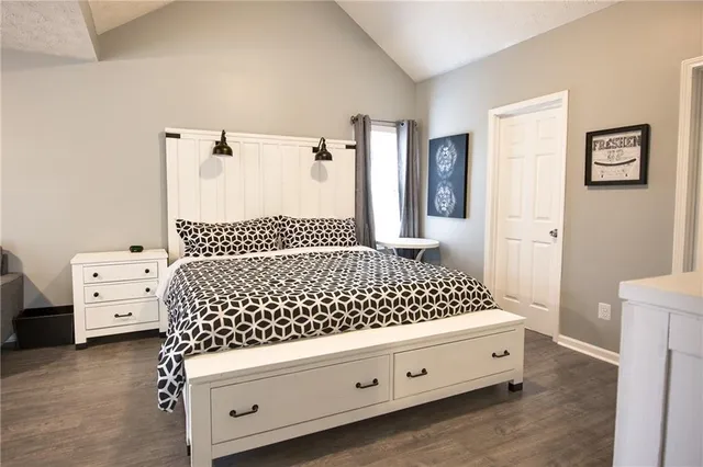 a bedroom with a bed and a dresser