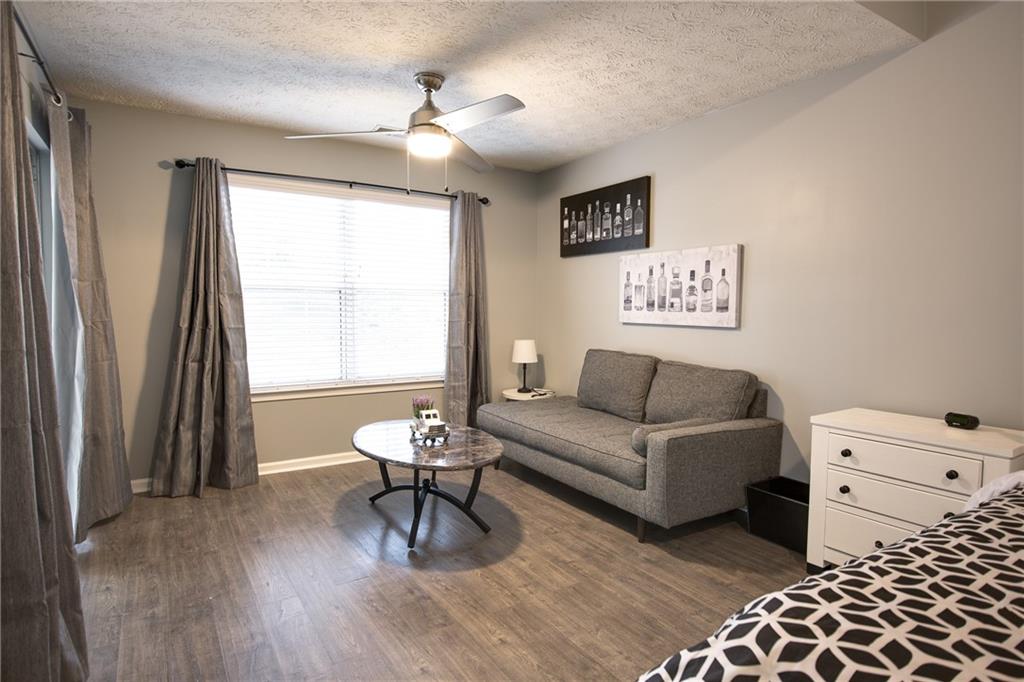 7151 Springchase Way Austell, GA 30168 - Photo 9 of 14 a living room with furniture and a window