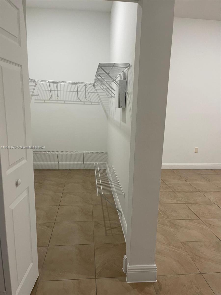 32050 Southwest 204th Avenue Homestead, FL 33030 - Photo 12 of 36 a view of walk in closet