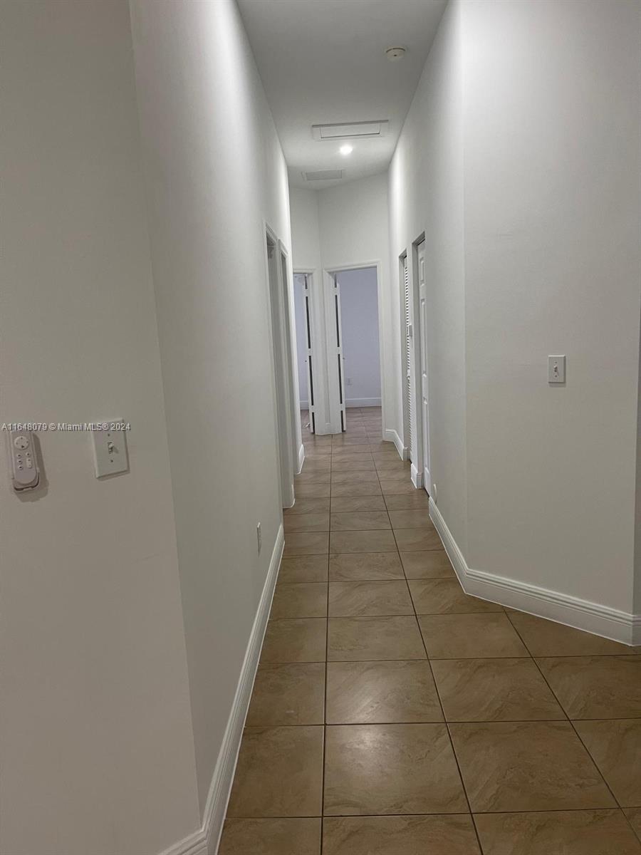 32050 Southwest 204th Avenue Homestead, FL 33030 - Photo 14 of 36 a view of a hallway