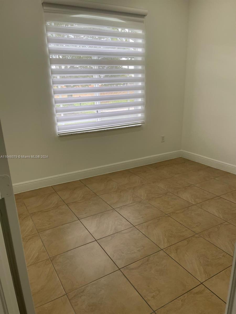 32050 Southwest 204th Avenue Homestead, FL 33030 - Photo 15 of 36 a view of a window in a room