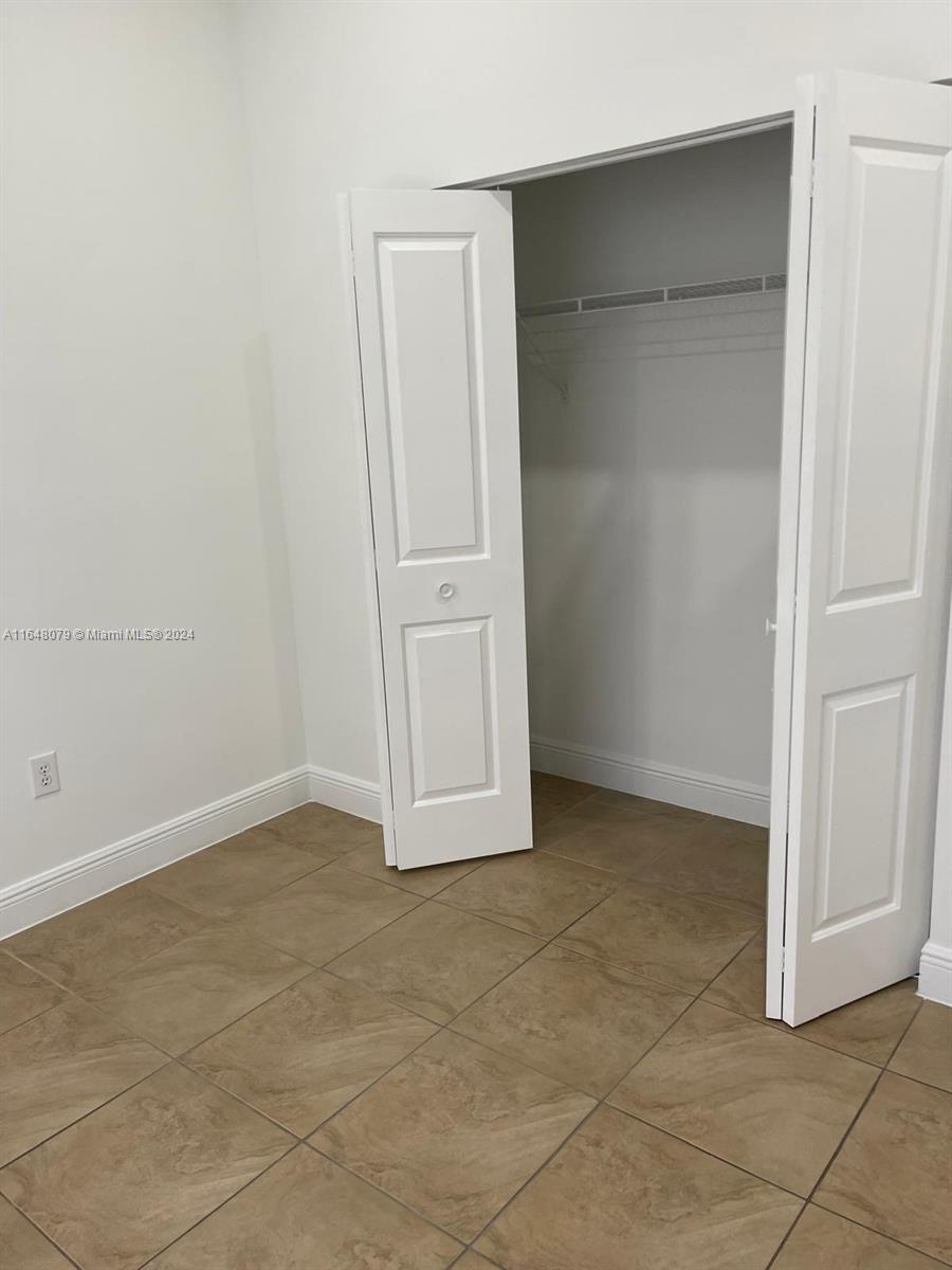 32050 Southwest 204th Avenue Homestead, FL 33030 - Photo 16 of 36 an empty room with a empty space