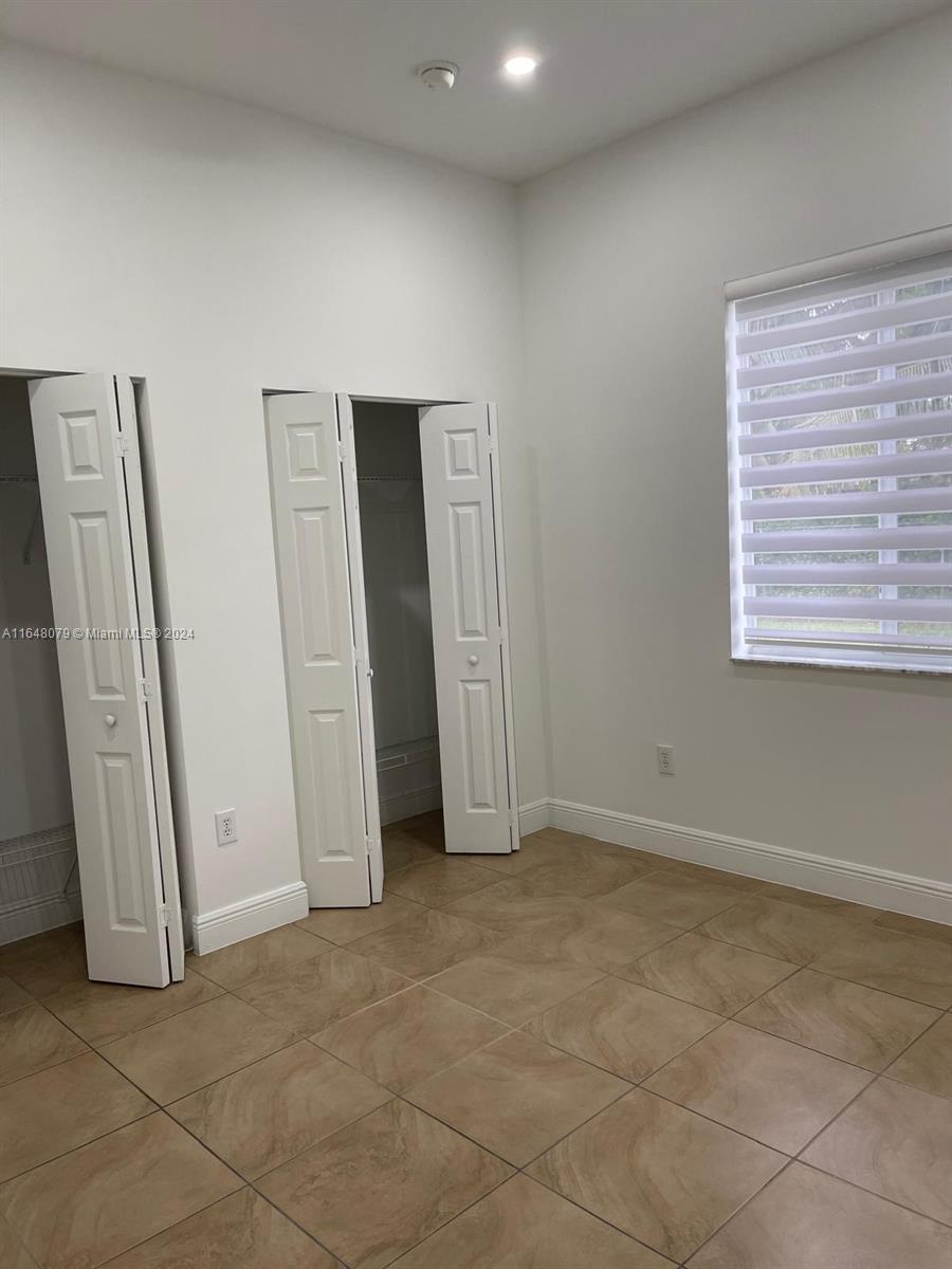 32050 Southwest 204th Avenue Homestead, FL 33030 - Photo 20 of 36 an empty room with windows