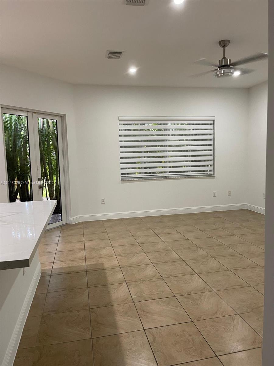32050 Southwest 204th Avenue Homestead, FL 33030 - Photo 21 of 36 a view of an empty room with a window