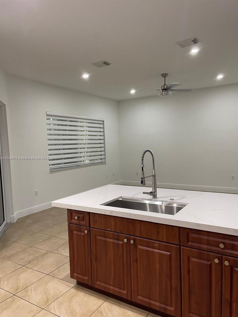 32050 Southwest 204th Avenue Homestead, FL 33030 - Photo 22 of 36 a kitchen with a sink and a window