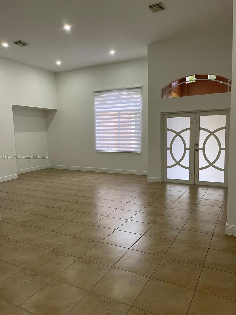 32050 Southwest 204th Avenue Homestead, FL 33030 - Photo 24 of 36 a view of an empty room with a window