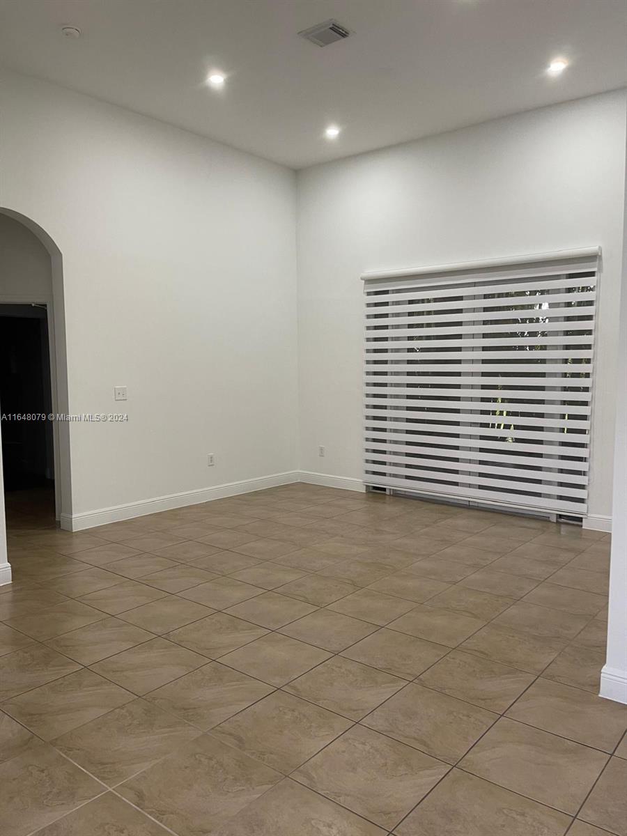 32050 Southwest 204th Avenue Homestead, FL 33030 - Photo 25 of 36 an empty room with a window