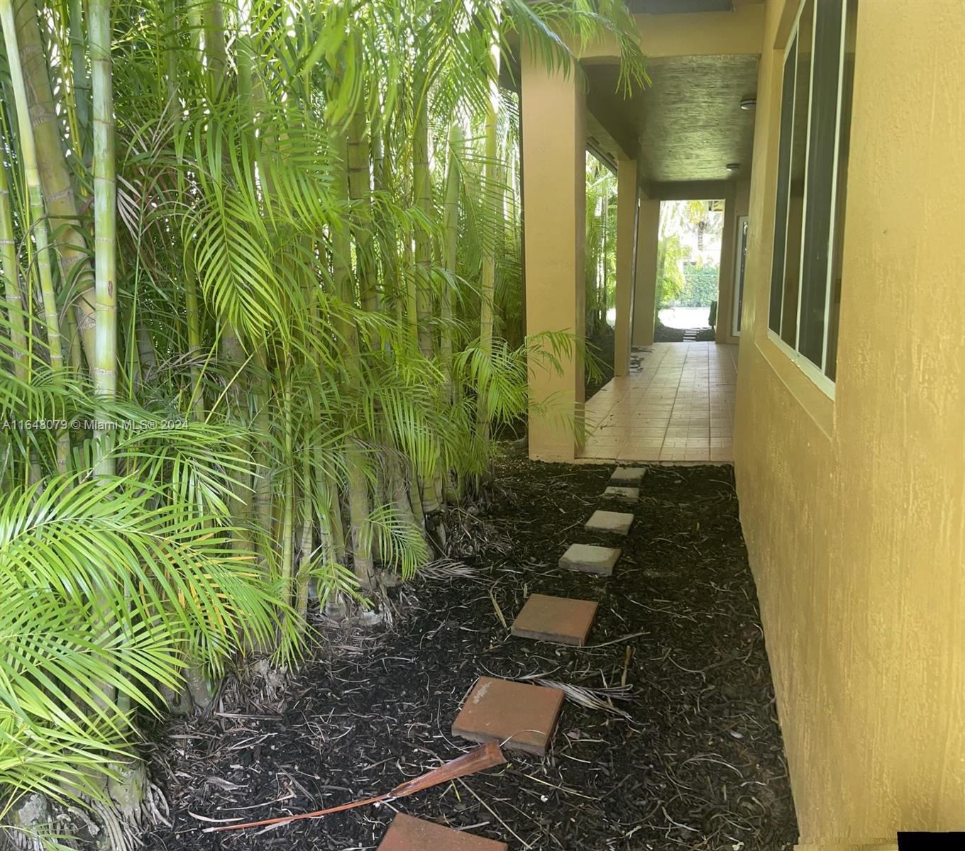 32050 Southwest 204th Avenue Homestead, FL 33030 - Photo 27 of 36 a view of a back yard of the house
