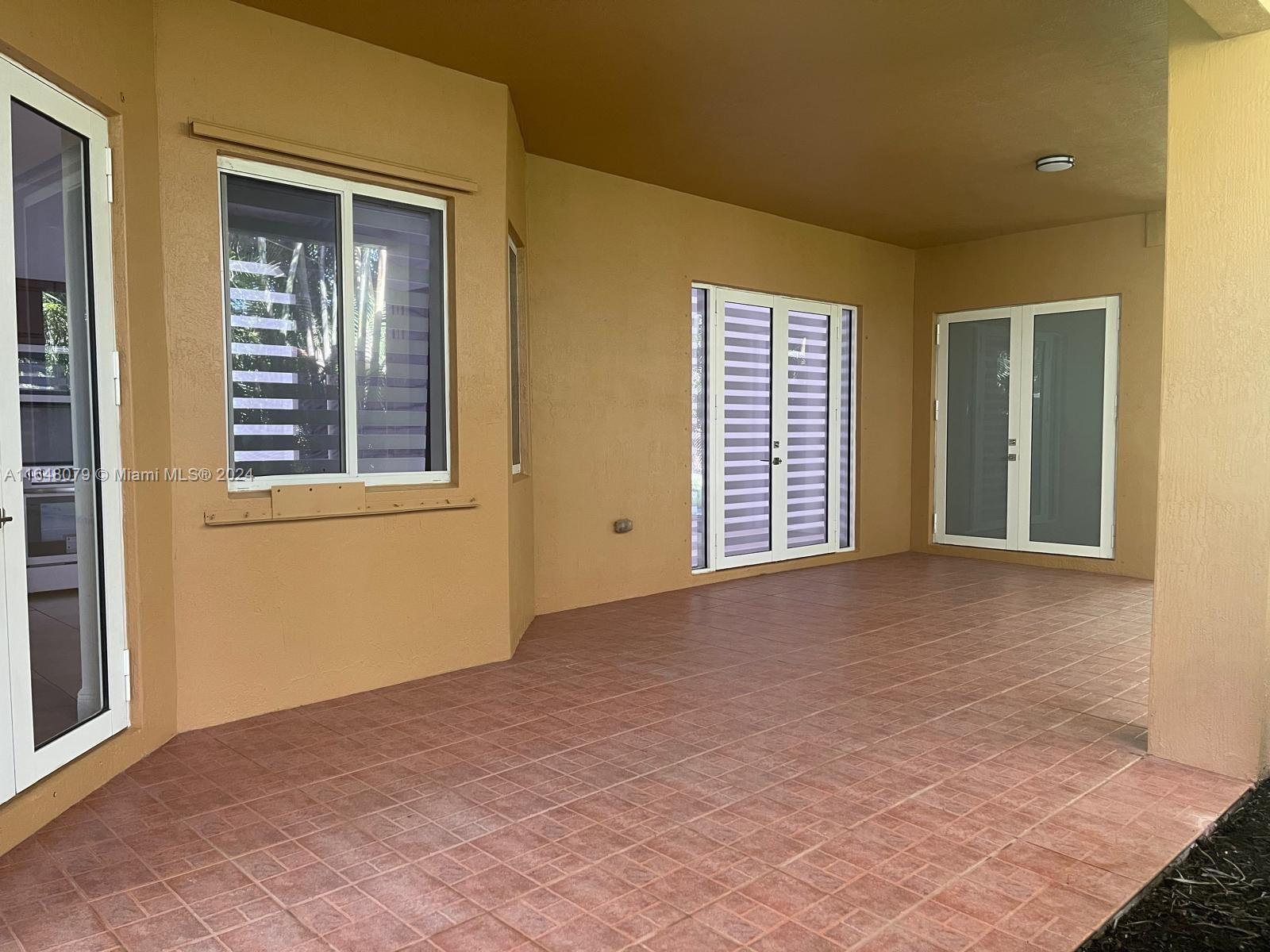 32050 Southwest 204th Avenue Homestead, FL 33030 - Photo 28 of 36 a view of an empty room with a window