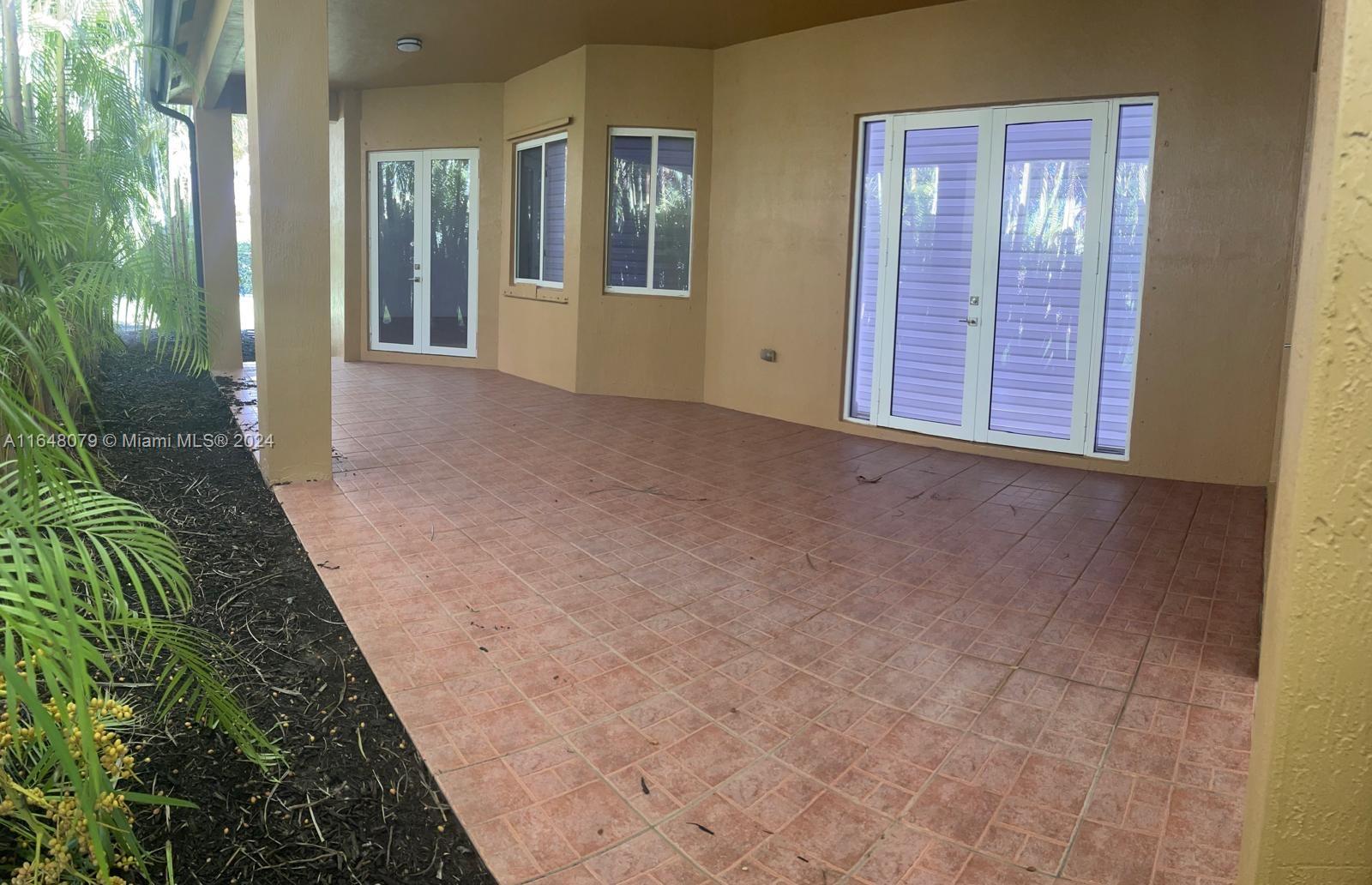 32050 Southwest 204th Avenue Homestead, FL 33030 - Photo 29 of 36 a view of a room with brick walls