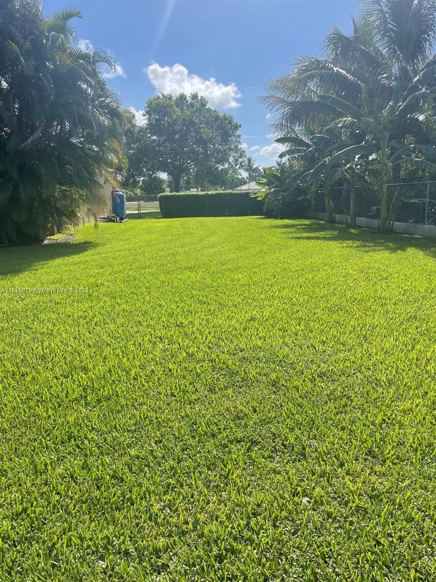 32050 Southwest 204th Avenue Homestead, FL 33030 - Photo 31 of 36 a view of an outdoor space and a yard