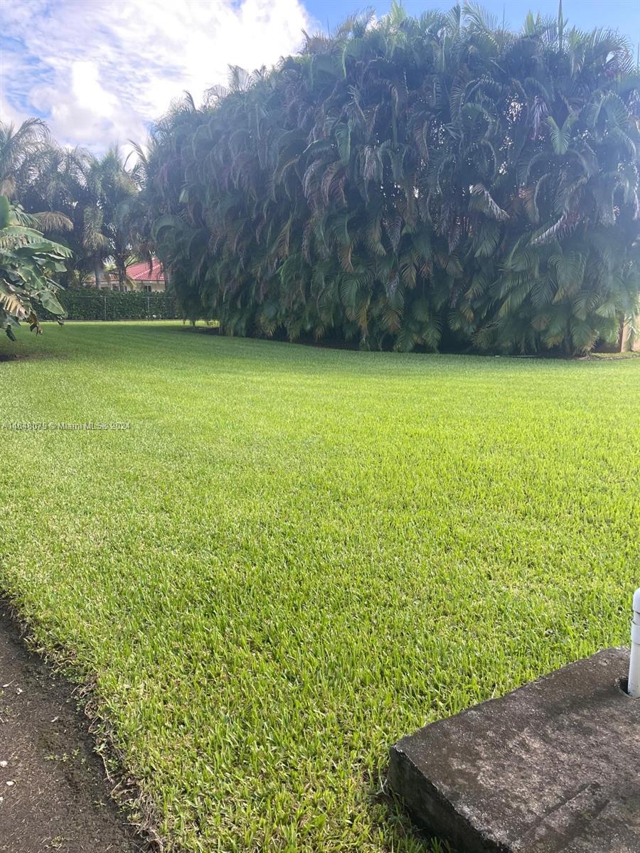 32050 Southwest 204th Avenue Homestead, FL 33030 - Photo 33 of 36 a view of a yard with an outdoor seating