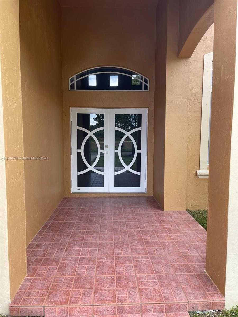 32050 Southwest 204th Avenue Homestead, FL 33030 - Photo 7 of 36 a view of a door of the house