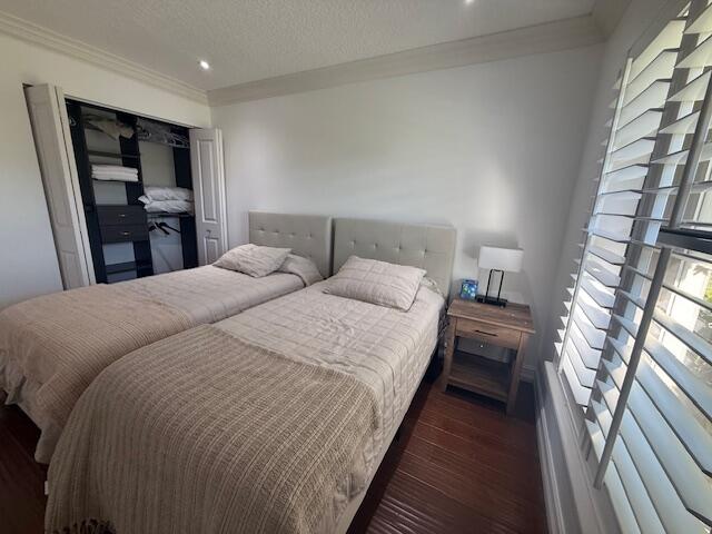 8458 Boca Glades Boulevard East Boca Raton, FL 33434 - Photo 11 of 28 a large bed sitting in a bedroom next to a window