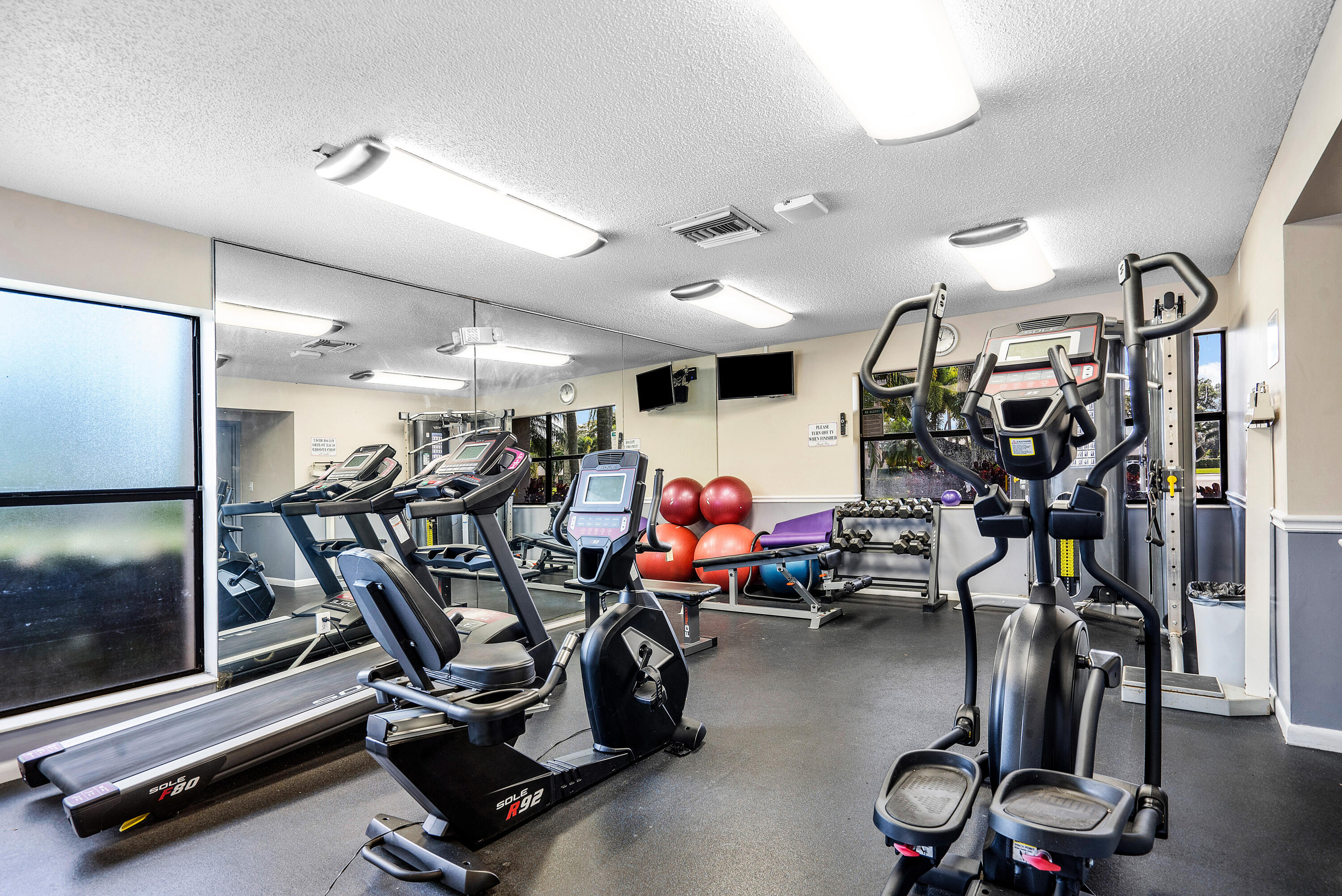 8458 Boca Glades Boulevard East Boca Raton, FL 33434 - Photo 18 of 28 a view of a room with gym equipment