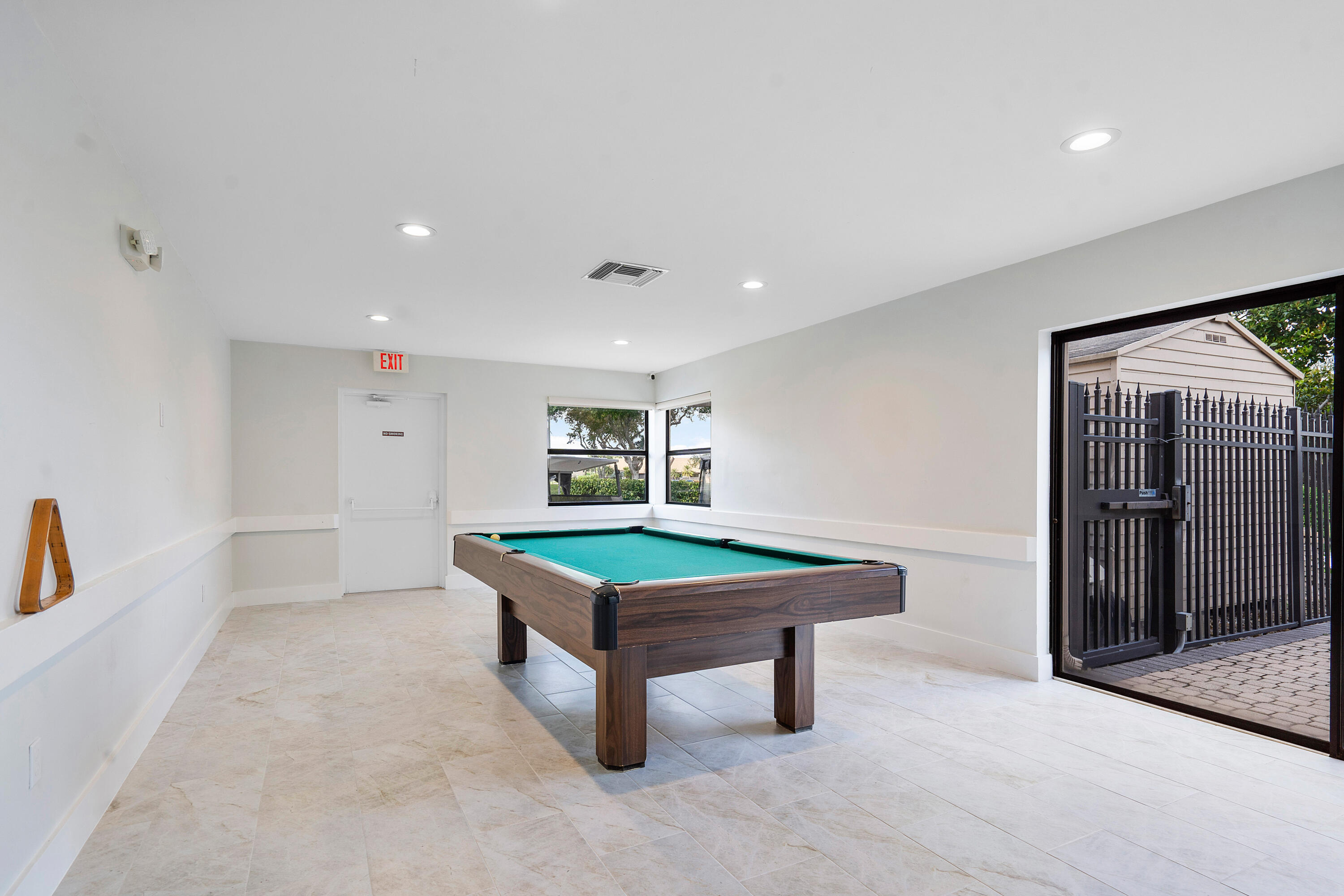 8458 Boca Glades Boulevard East Boca Raton, FL 33434 - Photo 20 of 28 a room with furniture and window
