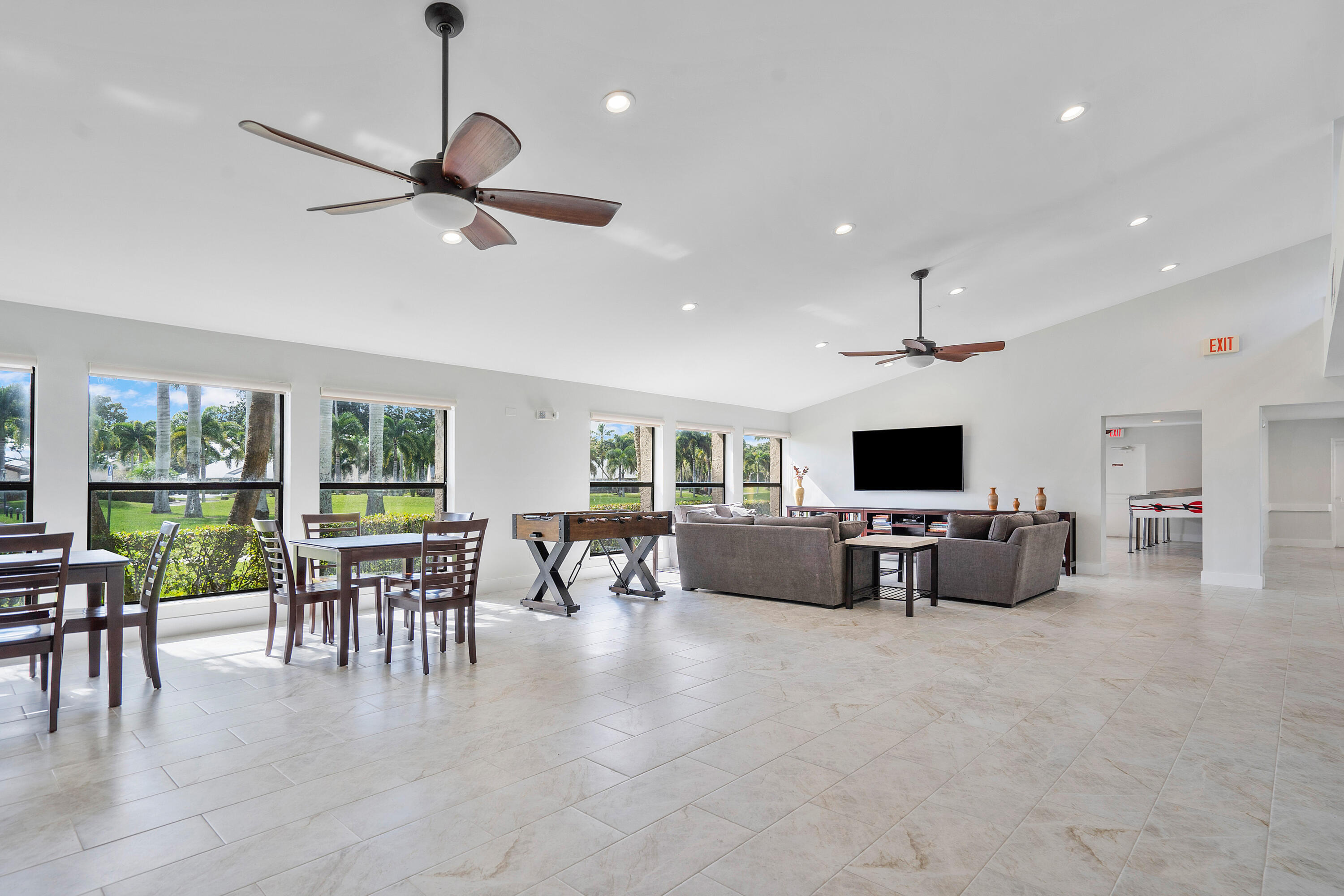 8458 Boca Glades Boulevard East Boca Raton, FL 33434 - Photo 21 of 28 a living room with furniture and a flat screen tv