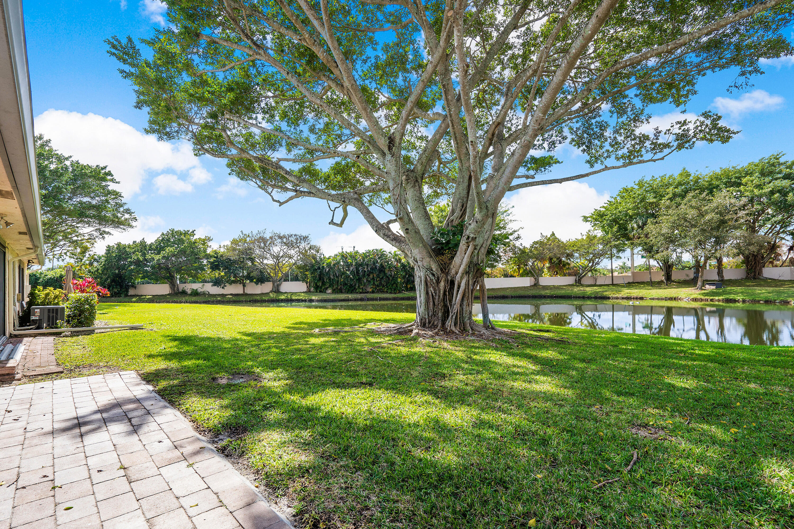 8458 Boca Glades Boulevard East Boca Raton, FL 33434 - Photo 28 of 28 a view of swimming pool with a yard