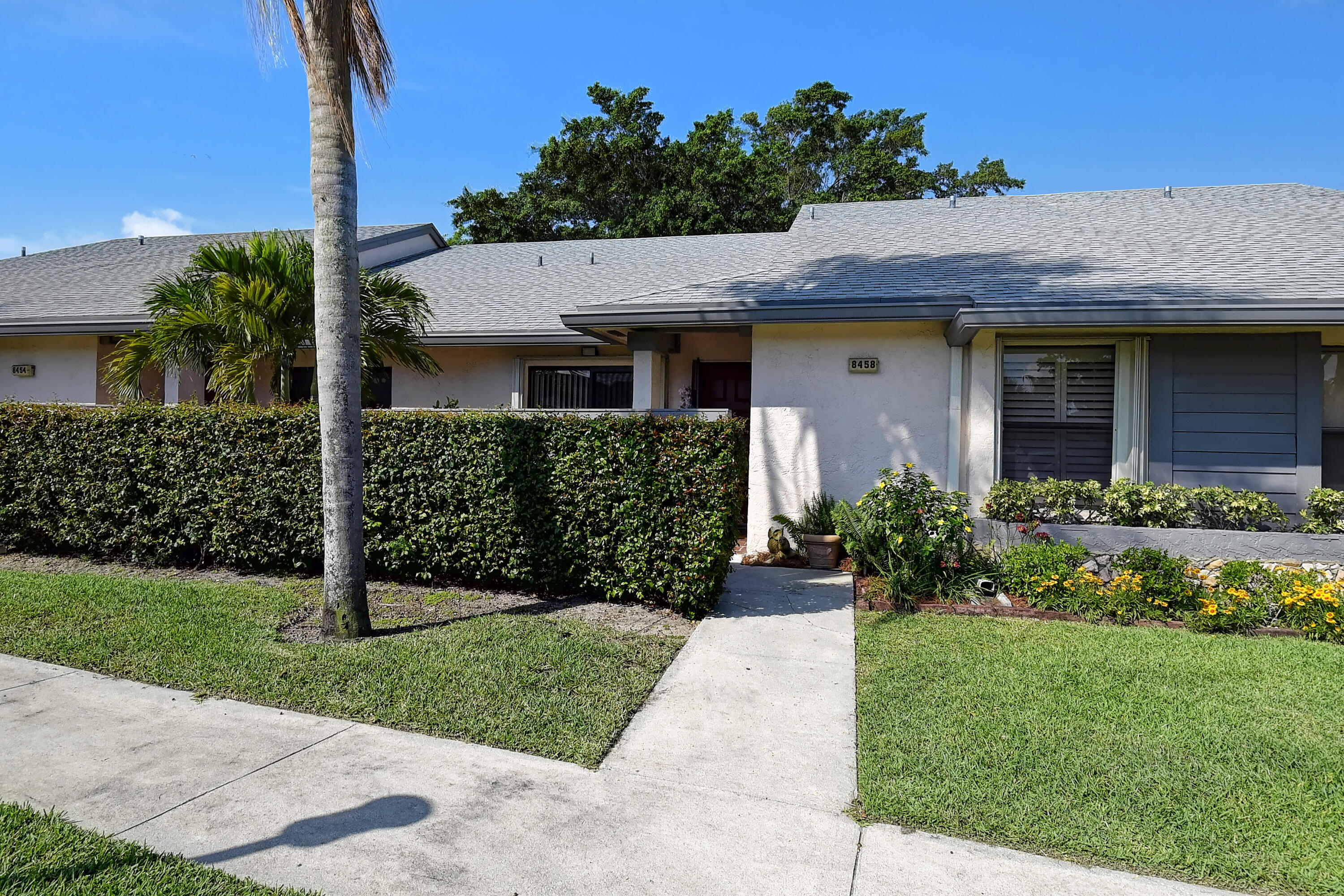 8458 Boca Glades Boulevard East Boca Raton, FL 33434 - Photo 3 of 28 a view of a house with a yard