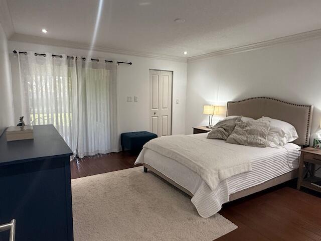 8458 Boca Glades Boulevard East Boca Raton, FL 33434 - Photo 6 of 28 a bedroom with a bed and a table