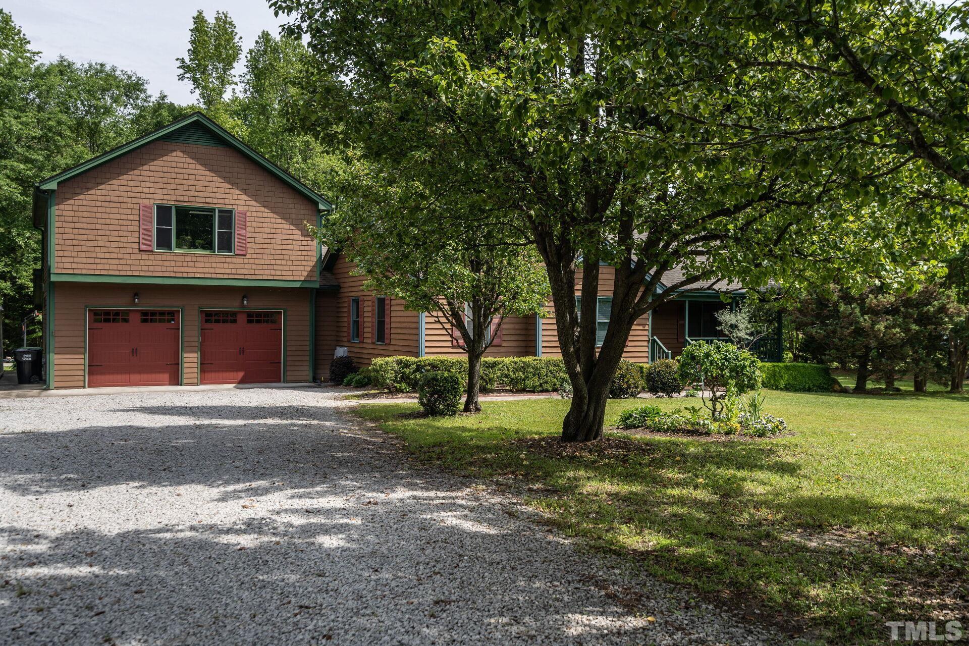920 Wagstaff Road Fuquay-Varina, NC 27526 - Photo 3 of 58 a view of a house with a yard