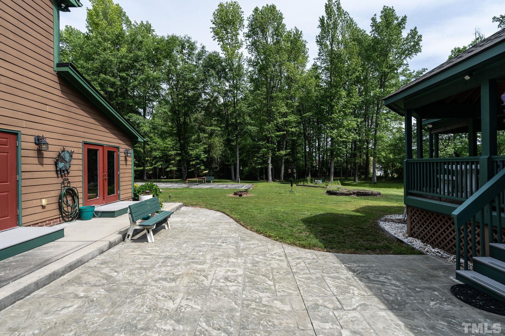 920 Wagstaff Road Fuquay-Varina, NC 27526 - Photo 33 of 58 a view of backyard with seating space and trees