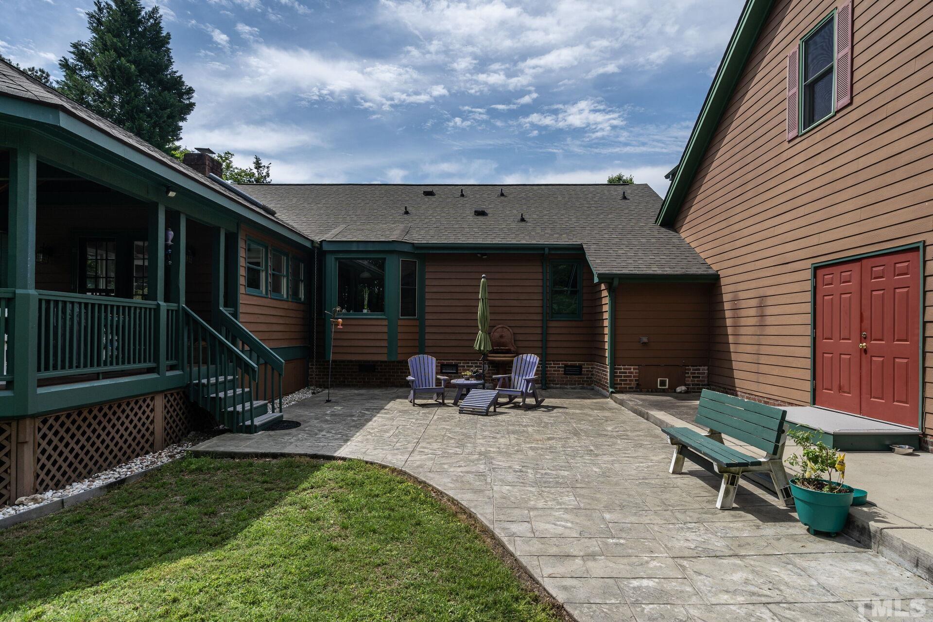 920 Wagstaff Road Fuquay-Varina, NC 27526 - Photo 34 of 58 a view of house with backyard outdoor seating and green space