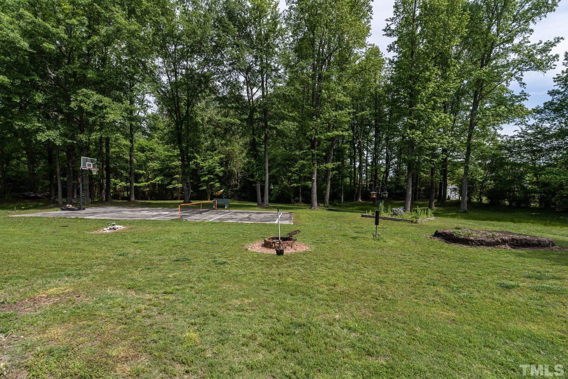 920 Wagstaff Road Fuquay-Varina, NC 27526 - Photo 35 of 58 a garden view with a trees