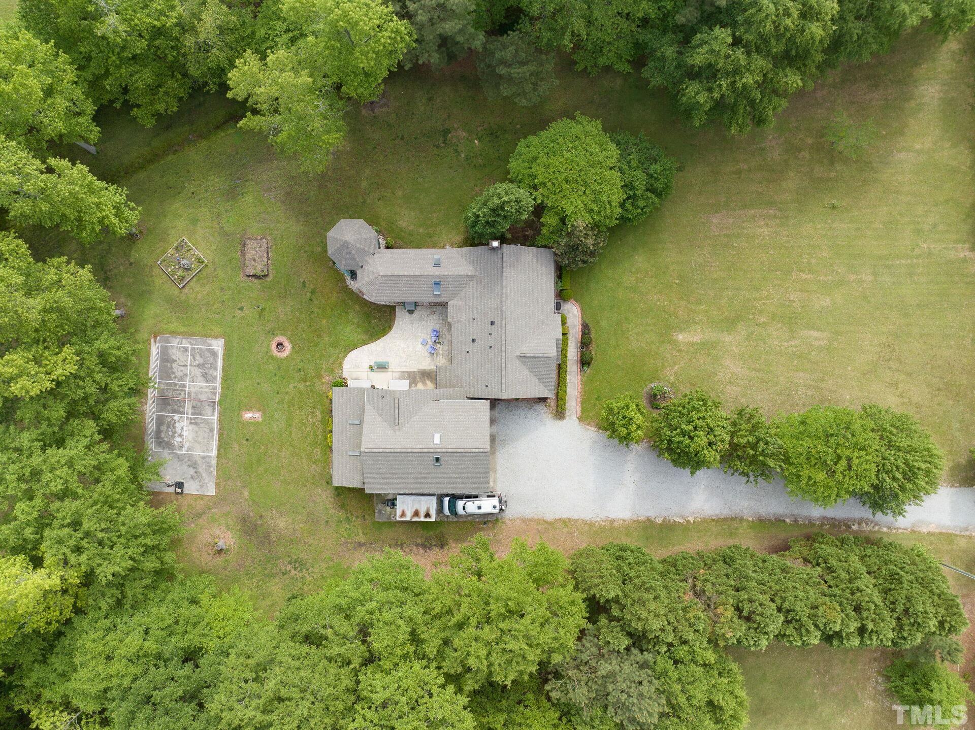 920 Wagstaff Road Fuquay-Varina, NC 27526 - Photo 41 of 58 an aerial view of a house with outdoor space and a lake view